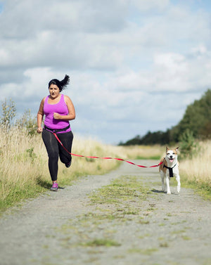 Person running with dog